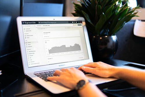 A man sits at a laptop, working on Google Search Console